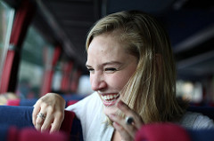 Laughing on the bus Woman laughing on the bus