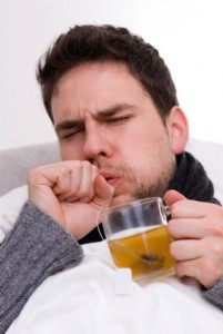 man in bed with cold and coughing