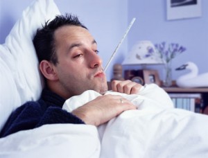 man in bed with the flu 