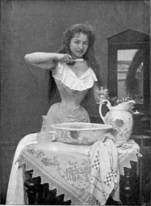 old photo of woman with small waist brushing her teeth
